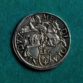 Berlinga . Verso della lira milanese in argento del sec. XVI recante l'immagine di S. Ambrogio a cavallo.Milano, M. Castello Berlinga . Verso della lira milanese in argento del sec. XVI recante l'immagine di S. Ambrogio a cavallo.Milano, M. Castello