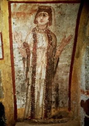 Catacomba. Affresco raffigurante un'orante nella catacomba romana dei Giordani.De Agostini Picture Library Catacomba. Affresco raffigurante un'orante nella catacomba romana dei Giordani.De Agostini Picture Library
