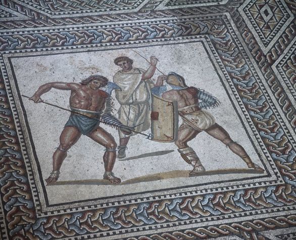 Gladiatori, mosaico in Germania Germania - Dintorni di Treviri - Nennig, villa romana. Mosaico pavimentale con medaglioni con scene di combattimento tra gladiatori nell'arena di Augusta Treverorum, II-III secolo. Particolare: tre gladiatori. Gladiatori, mosaico in Germania Germania - Dintorni di Treviri - Nennig, villa romana. Mosaico pavimentale con medaglioni con scene di combattimento tra gladiatori nell'arena di Augusta Treverorum, II-III secolo. Particolare: tre gladiatori.